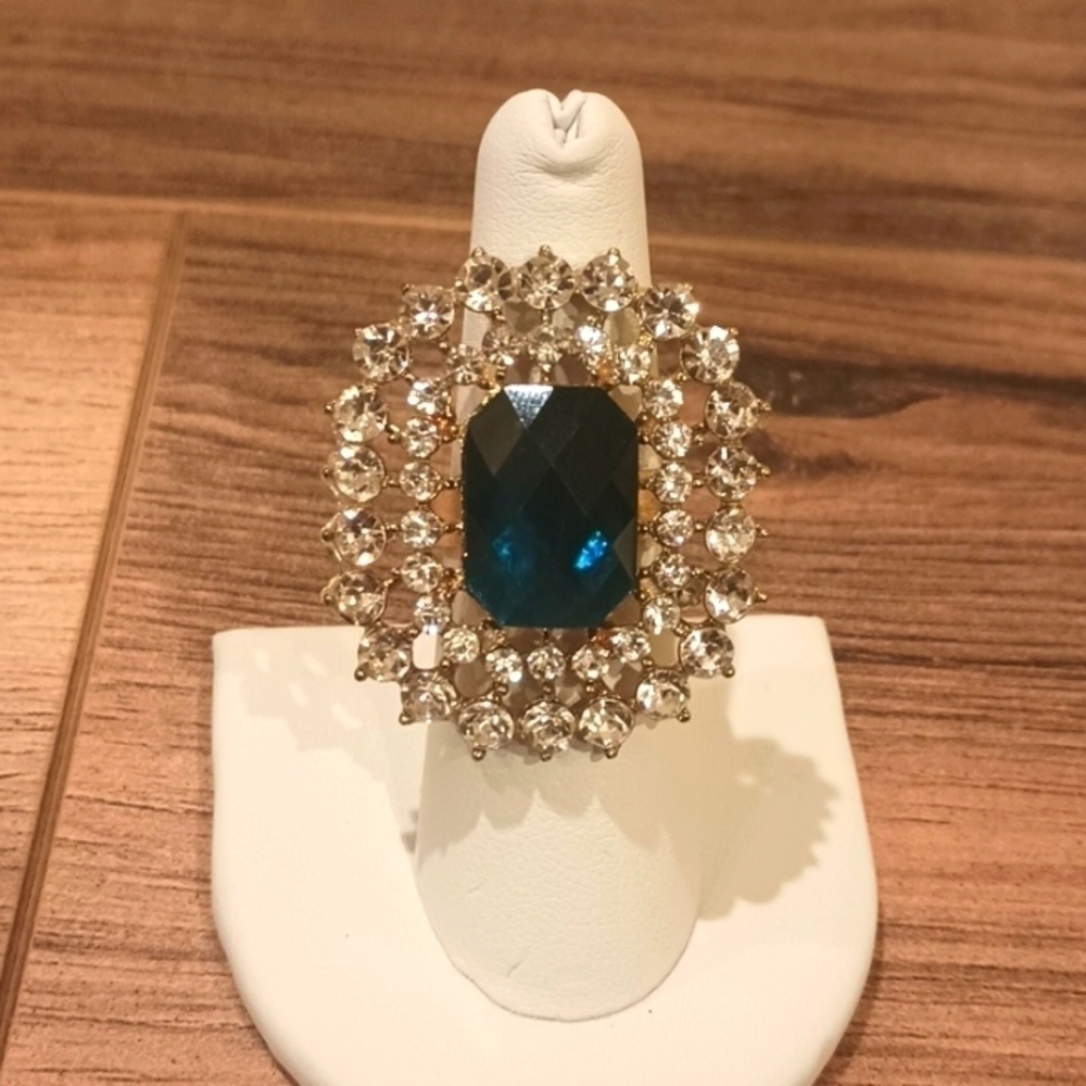 Large costume rhinestone ring with adjustable band in good used condition